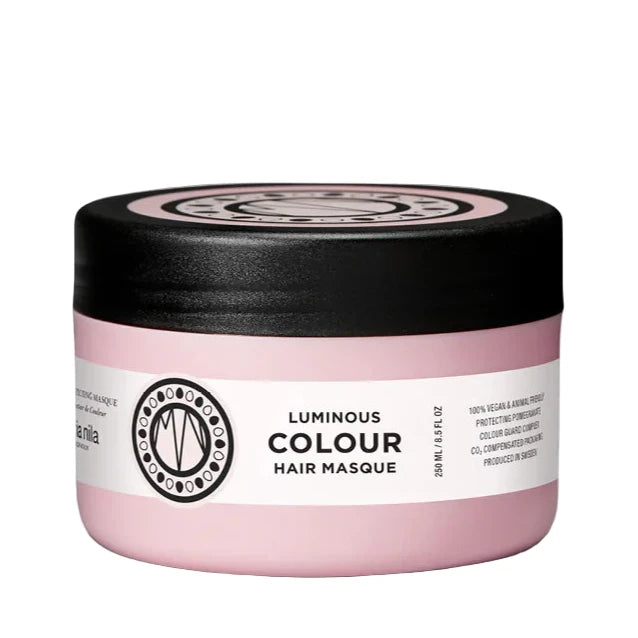 Pink hair mask jar with black lid on a white background