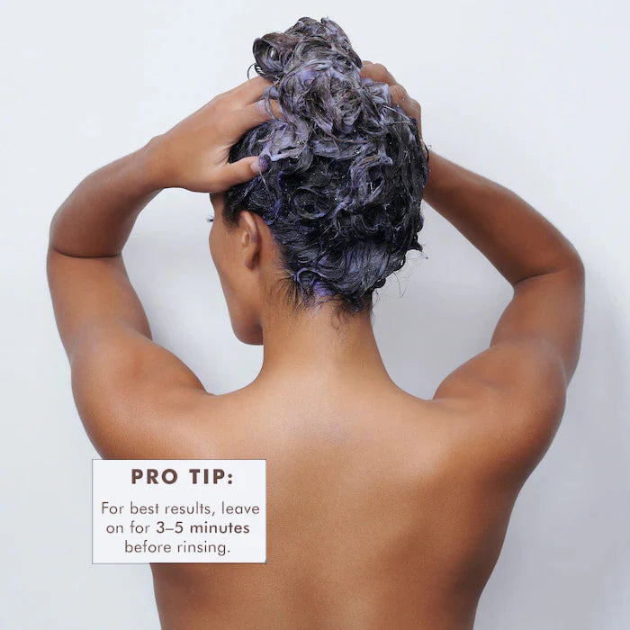 Moroccanoil Blonde Perfecting Shampoo and Conditioner image of model washing hair