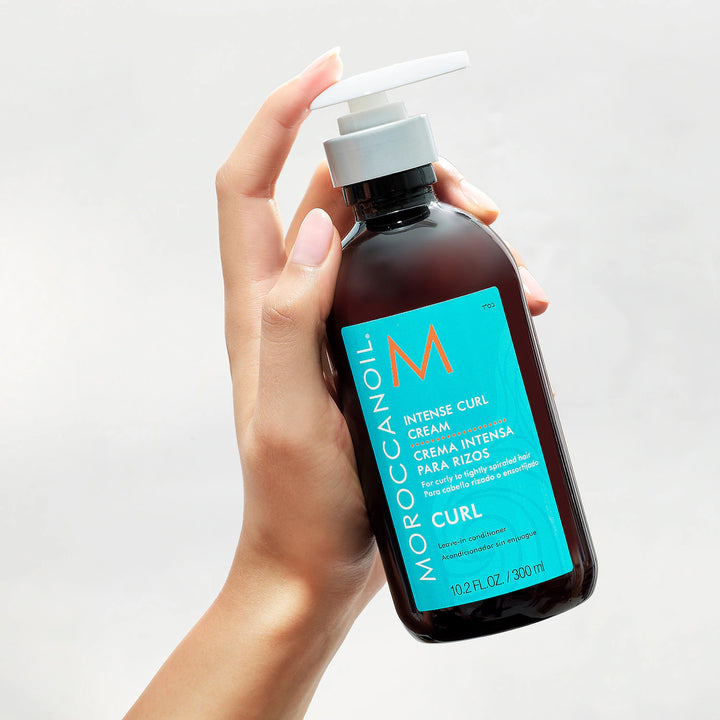Moroccanoil Intense Curl Cream image of model holding bottle