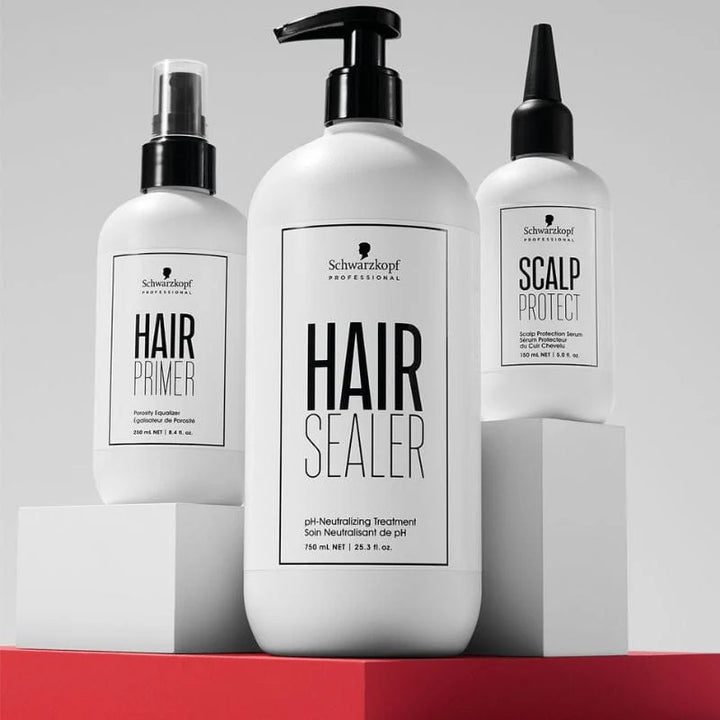 Three bottles of Schwarzkopf hair care products on a gray background with a red platform.