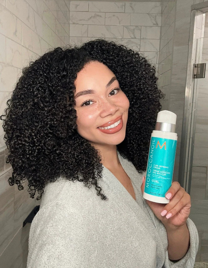 Moroccanoil Curl Defining Cream image of model before and after holding bottle