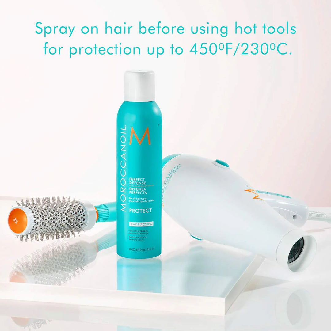 Moroccanoil Perfect Defense Heat Protectant image of product with brush and blow dryer
