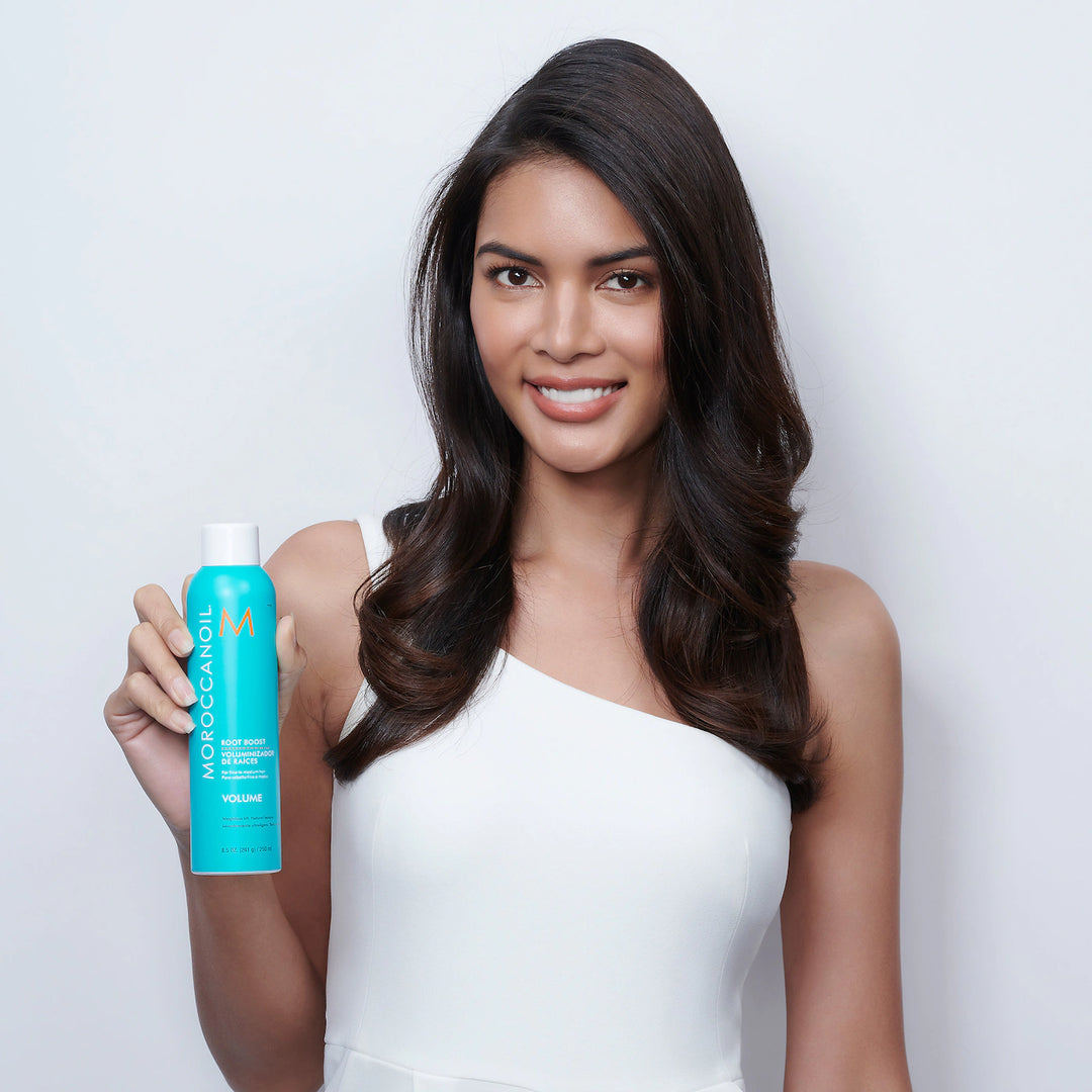 Moroccanoil Root Boost image of model holding spray