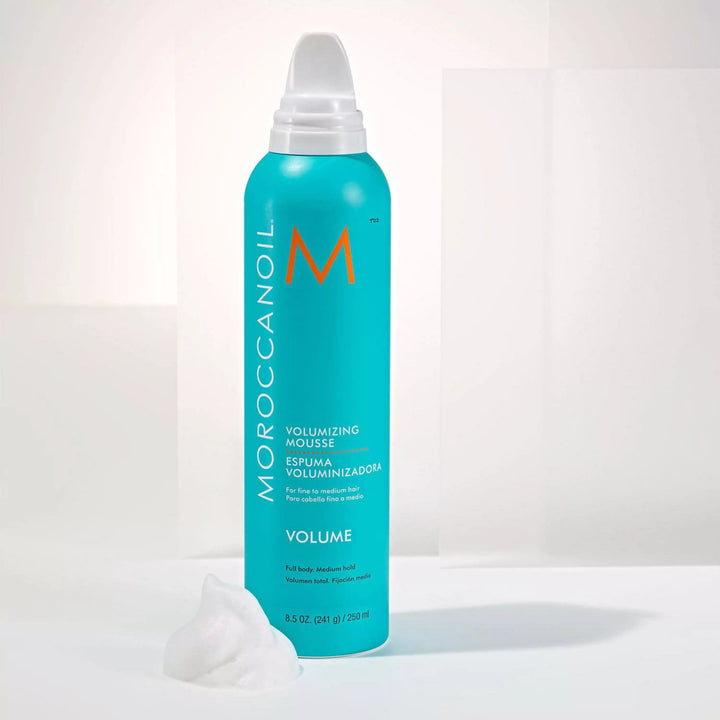 Moroccanoil Volumizing Mousse image of 8.5 oz bottle and product texture