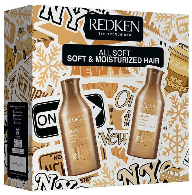 Redken hair care product packaging with branding and product images on a decorative background.